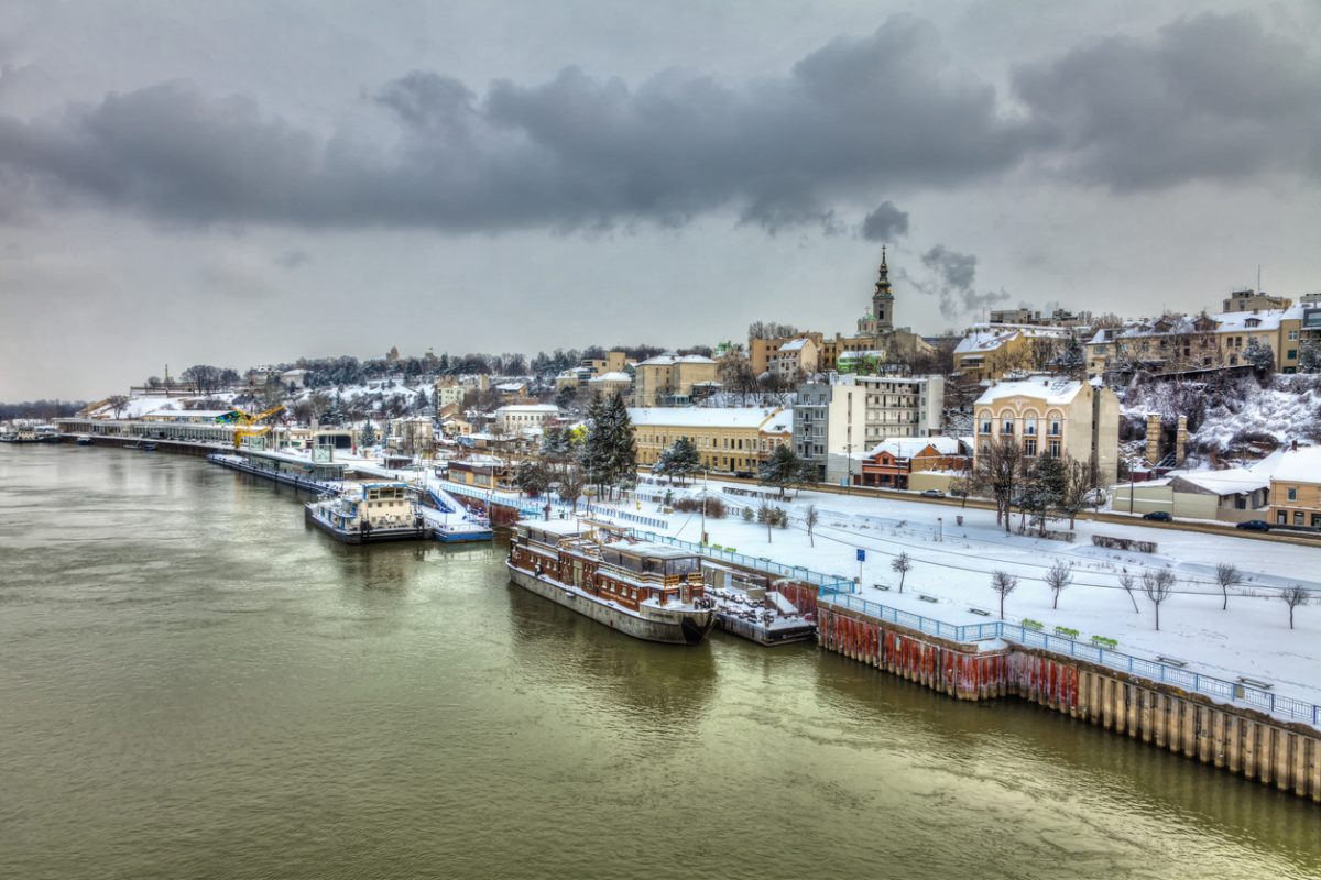 A concrete ship in the Belgrade harbor and a snow covered city. HDR images