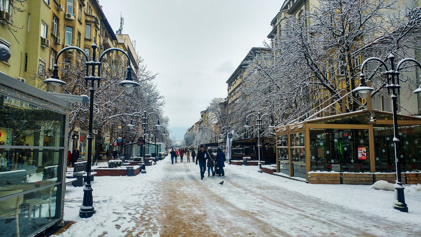 Sofia, Bulgaria - January 22, 2018: Sofia pedestrian walking street covered with snow at a winter morning with people walking
