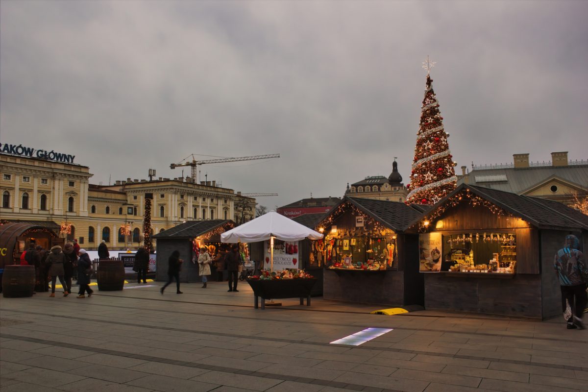 Krakow, Poland - November 30, 2014: A view of gift and souvenir shops before christmas tree