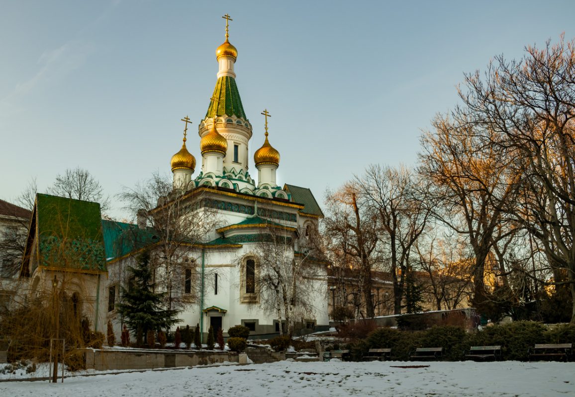A small russian orthodox church with golden domes in the center of the bulgarian capital, in Sofia