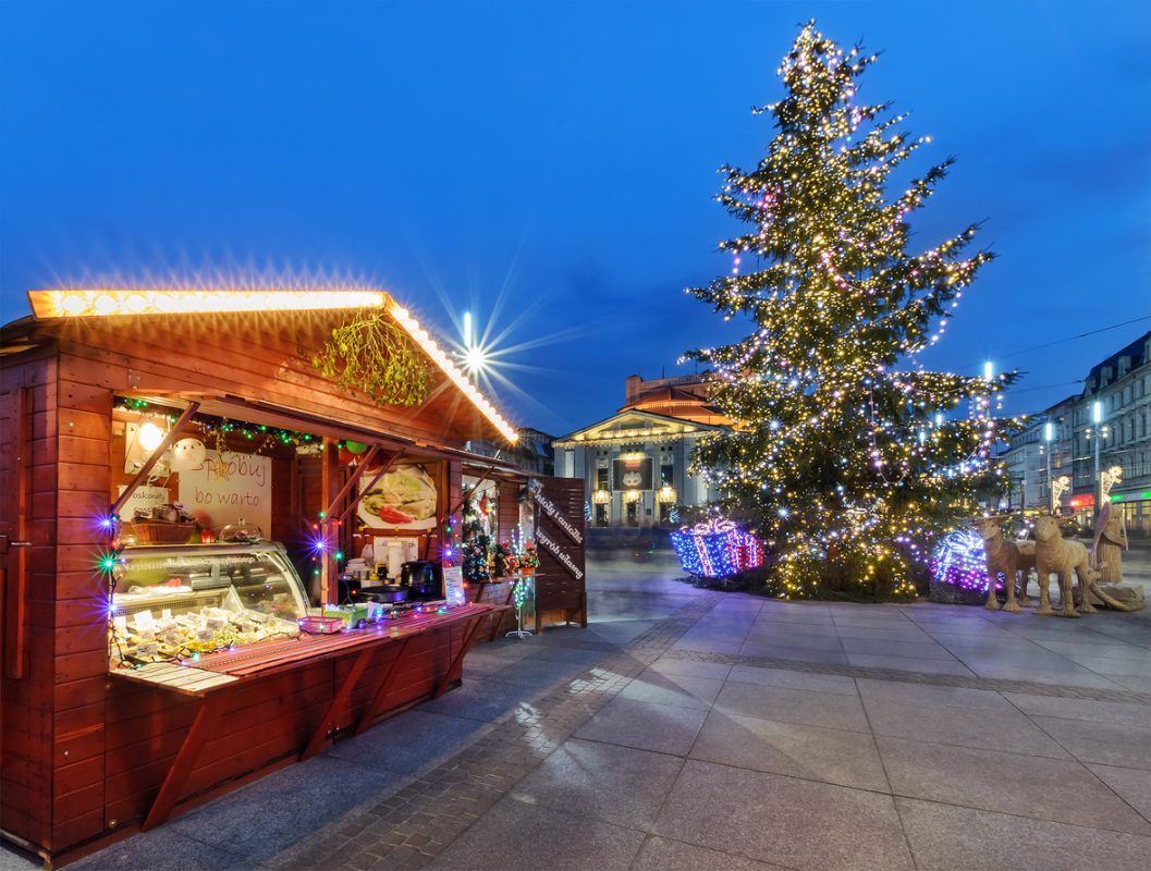 Katowice, Poland - December 11, 2015: Traditional street market and Christmas tree in main squere  of Katowice. Katowice is a city in southwestern Poland, with a population of 304,362 as of 2013.