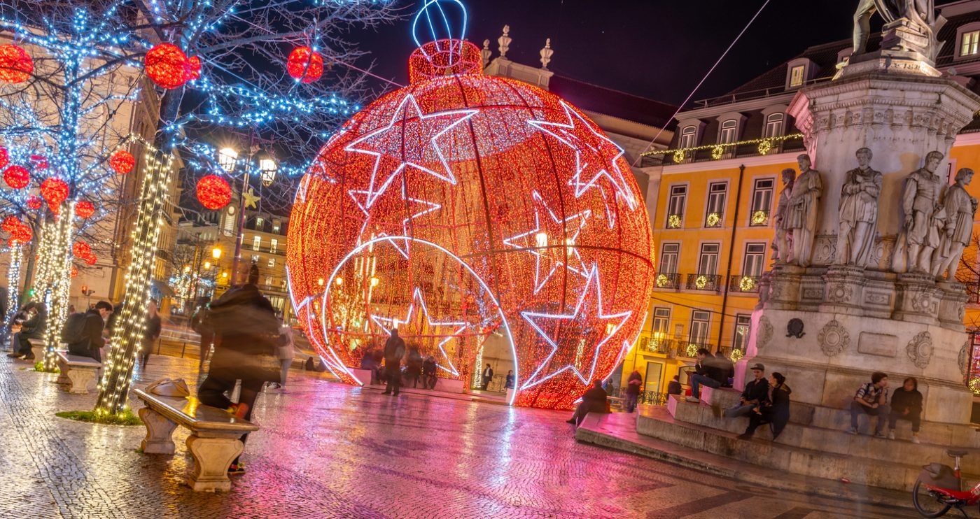 This pic shows huge red christmas ball in centre of lisbon. Image shows Illuminated night view of Lisbon city in Christmas , Lisbon Portugal. The Pic is taken in January 2020 in lisbon.