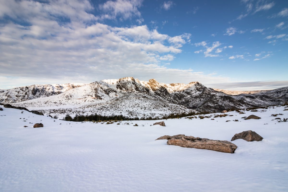 Snowy landscape in Serra da Estrela with a perspective on the rock formations of the upper plateau, known as "Os Três Cântaros" and on the "Nave de Santo António", a glacial flattened depression.