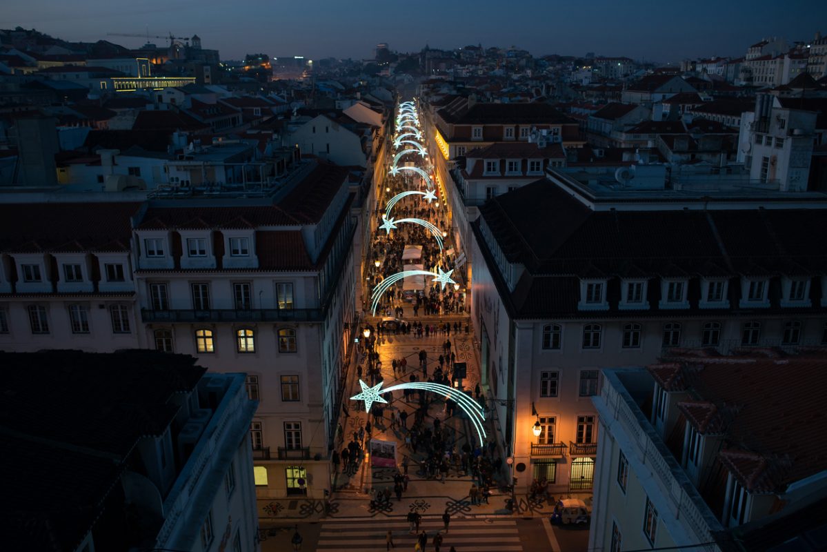 Rua Augusta street in Lisbon illuminated with falling stars during Christmas time, night photo, view from above