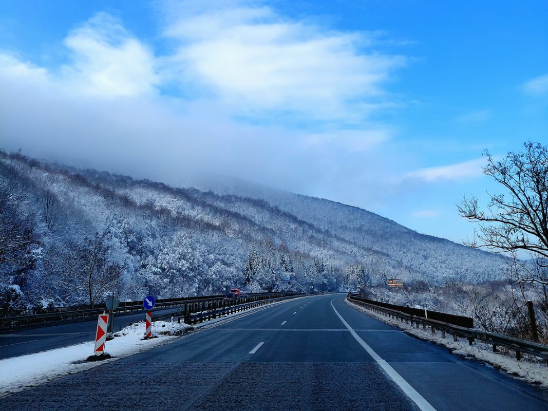 Mountain road on winter in Bulgaria. Road runs around the mountains.