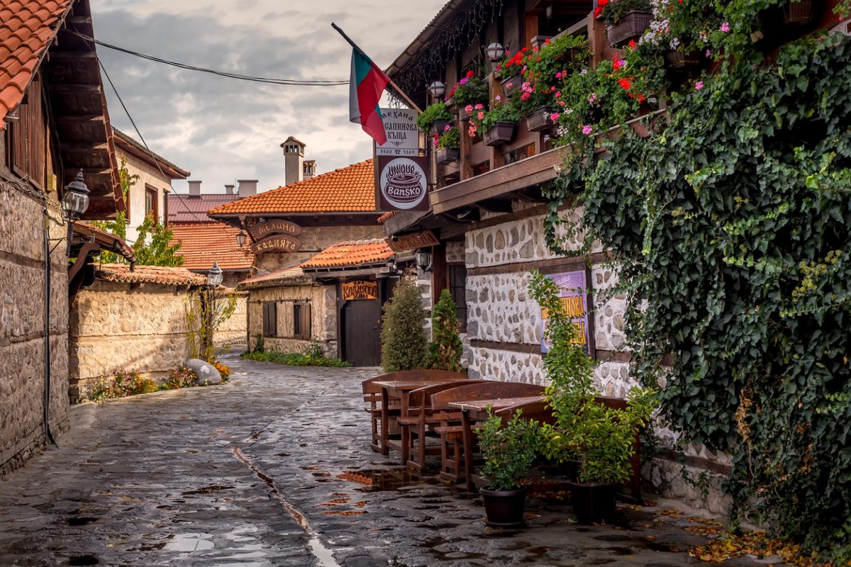 Bansko, Bulgaria - October 31, 2020: Autumn street view in downtown, old traditional bulgarian house, mehana