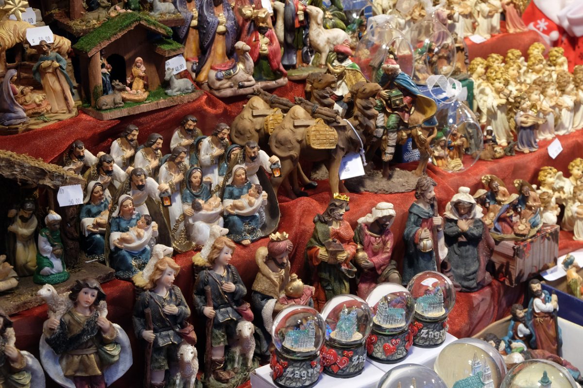 Decorative figurine on stall with decorations for winter holidays at traditional annual Christmas market in Zagreb, Croatia