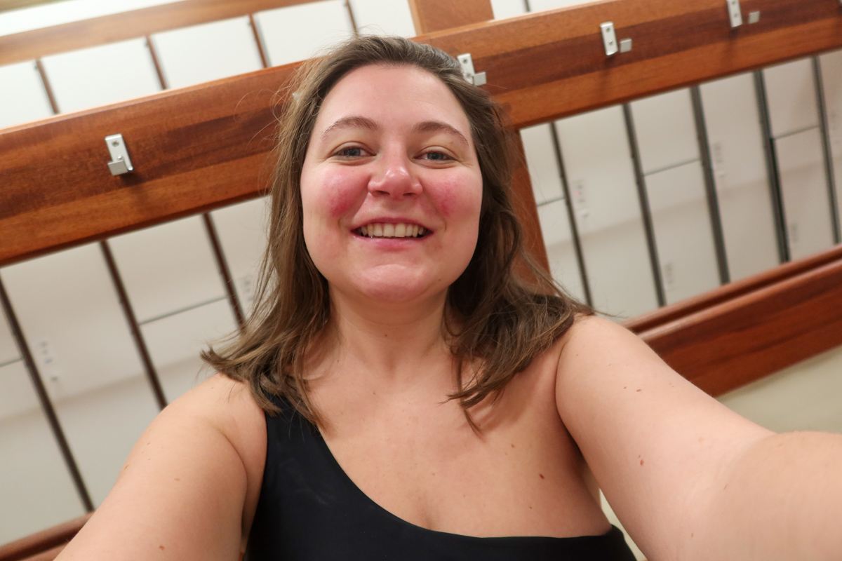 Girl in Laugardalslaug, taking a selfie. She is ready to swim.