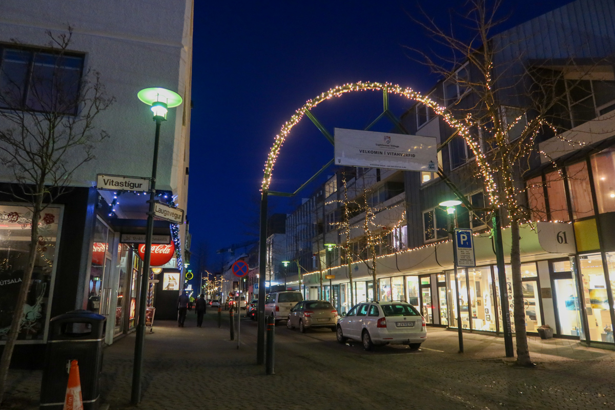 View of Reykjavik in the very early morning light with lights strung along the street.