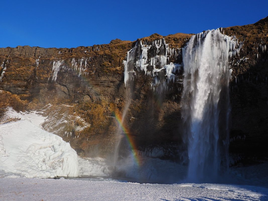 One of the best waterfalls in Iceland, which freezes over in winter with snowy cliffs and snow.