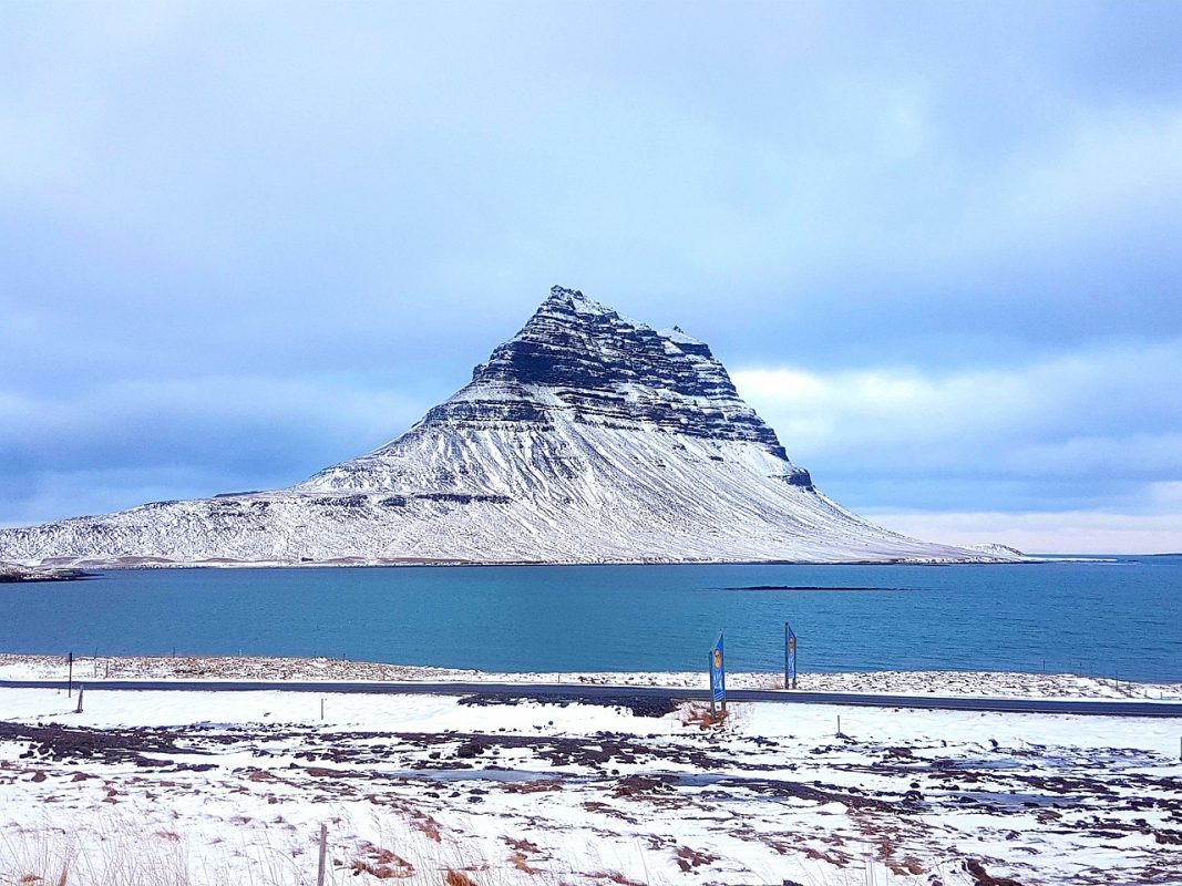 Kirkjufell, the most famous peak on snaefellsnes Peninsula in Iceland, one of the best day trips from Reykjavik in winter in the snow.
