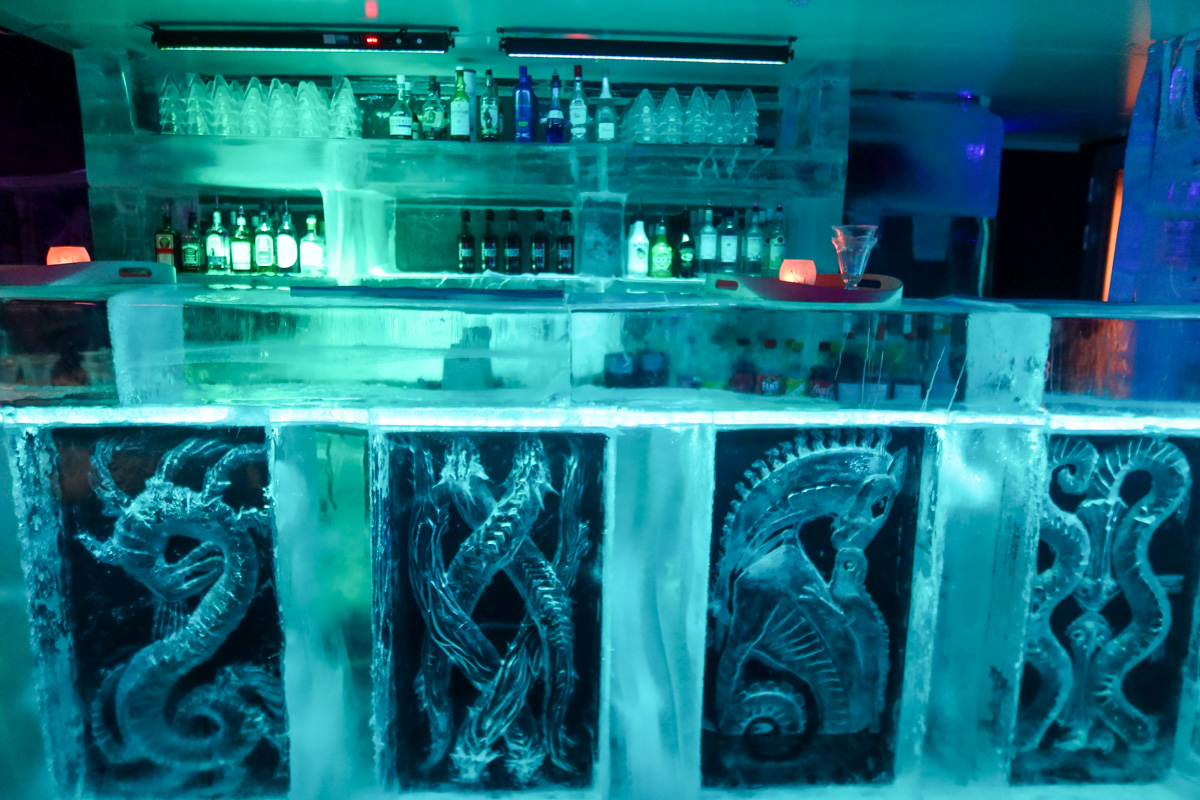 The bar at the Magic Ice Bar in Bergen, made from ice and with drinks behind. 