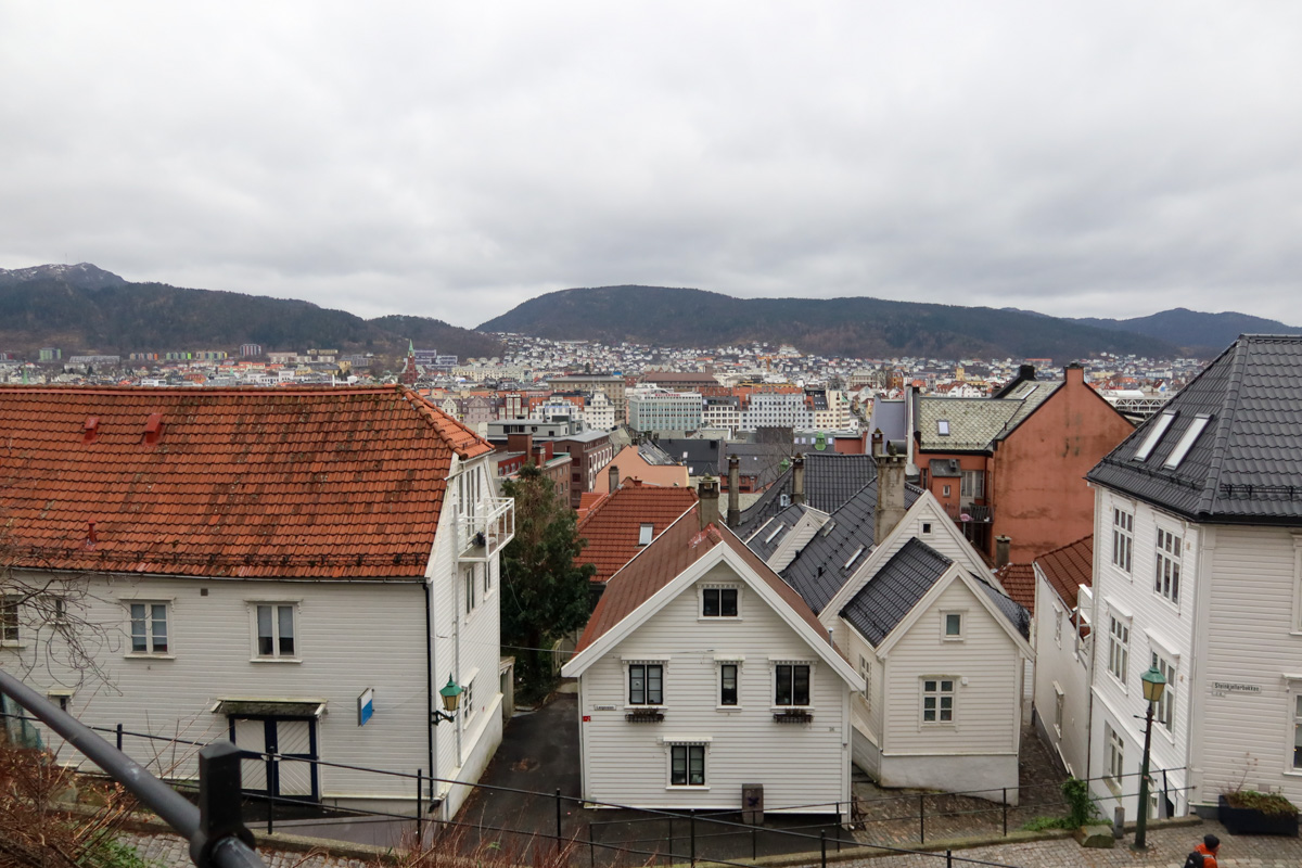 Winter scenes in Bergen, with houses at the bottom of the photo and clouds towards the top