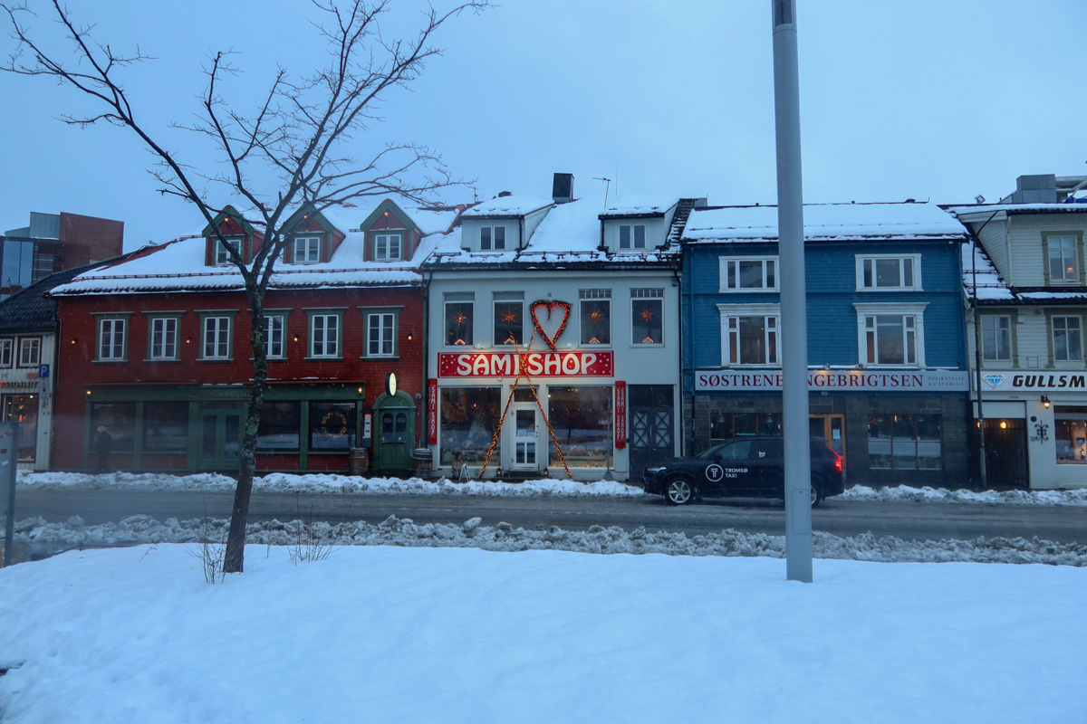 Explore Tromso in winter with shops and snow-covered streets