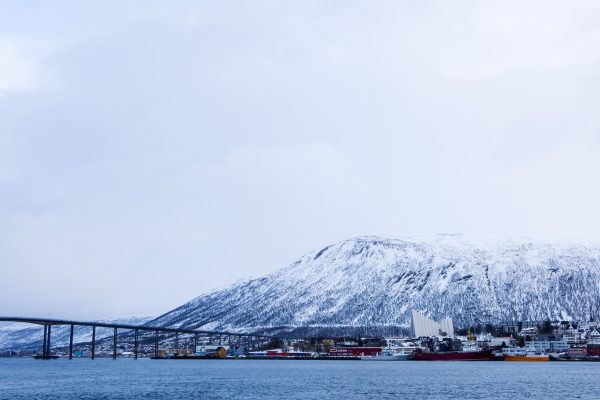 View of the Arctic Cathedral, Tromso bridge and the mountains in the background.