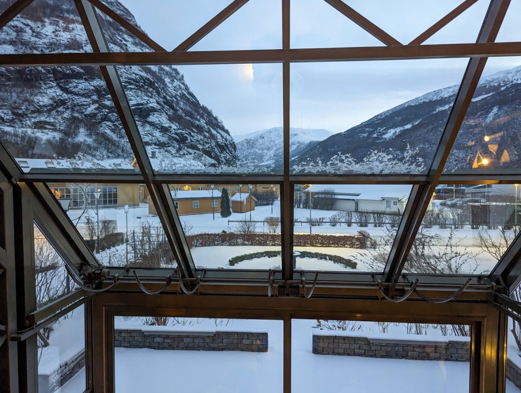 Views of the mountains and frozen fjords from the lobby of the Fretheim Hotel, with huge windows overlooking the snow