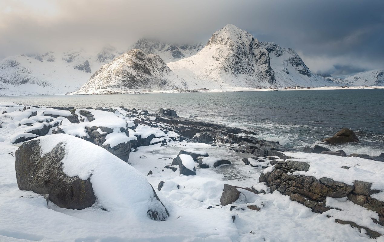 Lofoten Islands in winter, with snow covered peaks in the background