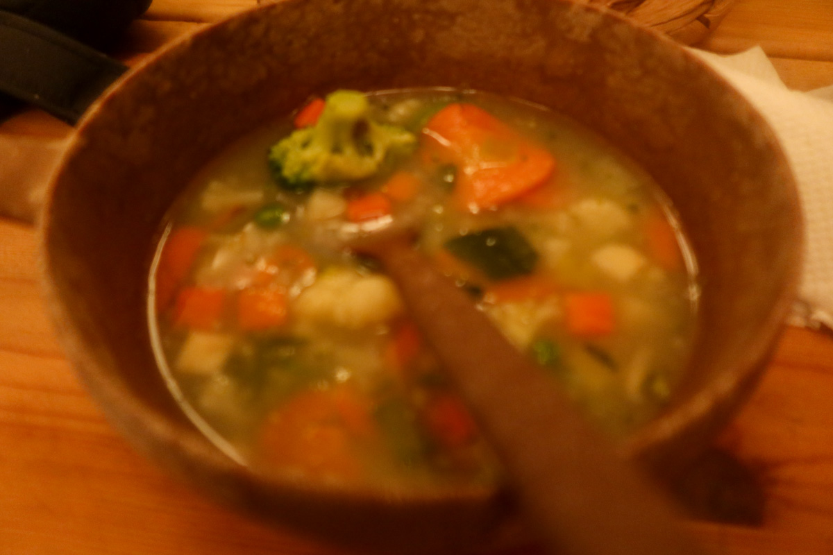 Vegetarian stew in a bowl in a cosy lavvu