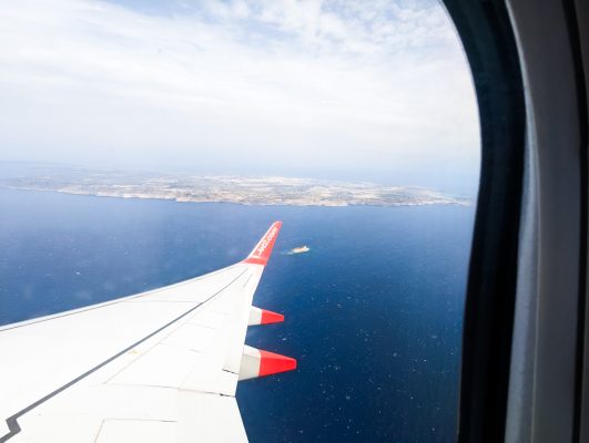 Jet2 plane wing and whole island of Malta in background