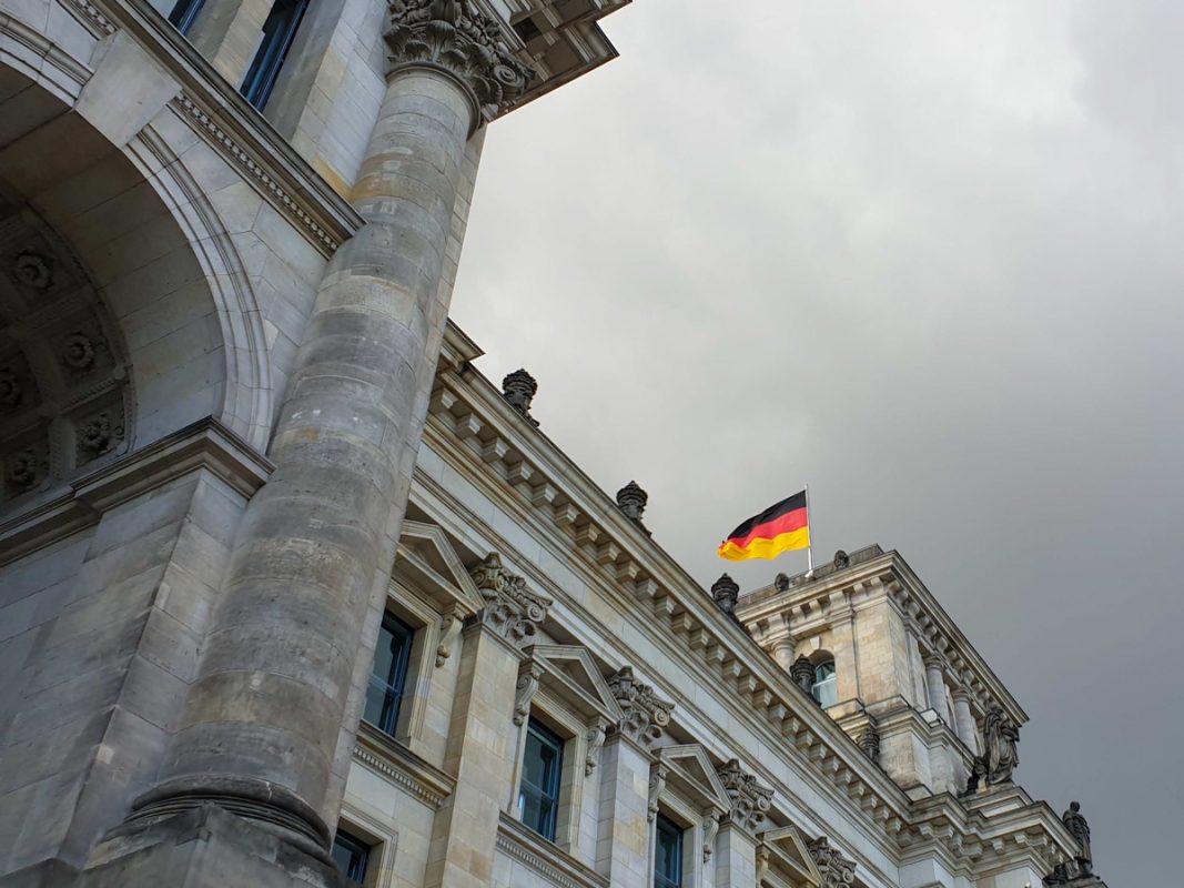 Grey building with German flag flying