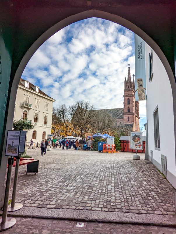 Cobblestone square with Cathedral in background.