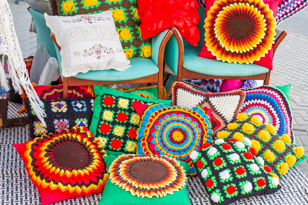 Beautiful and colorful handmade cushions, displayed in a hippy market of Ibiza, Balearic Islands, Spain