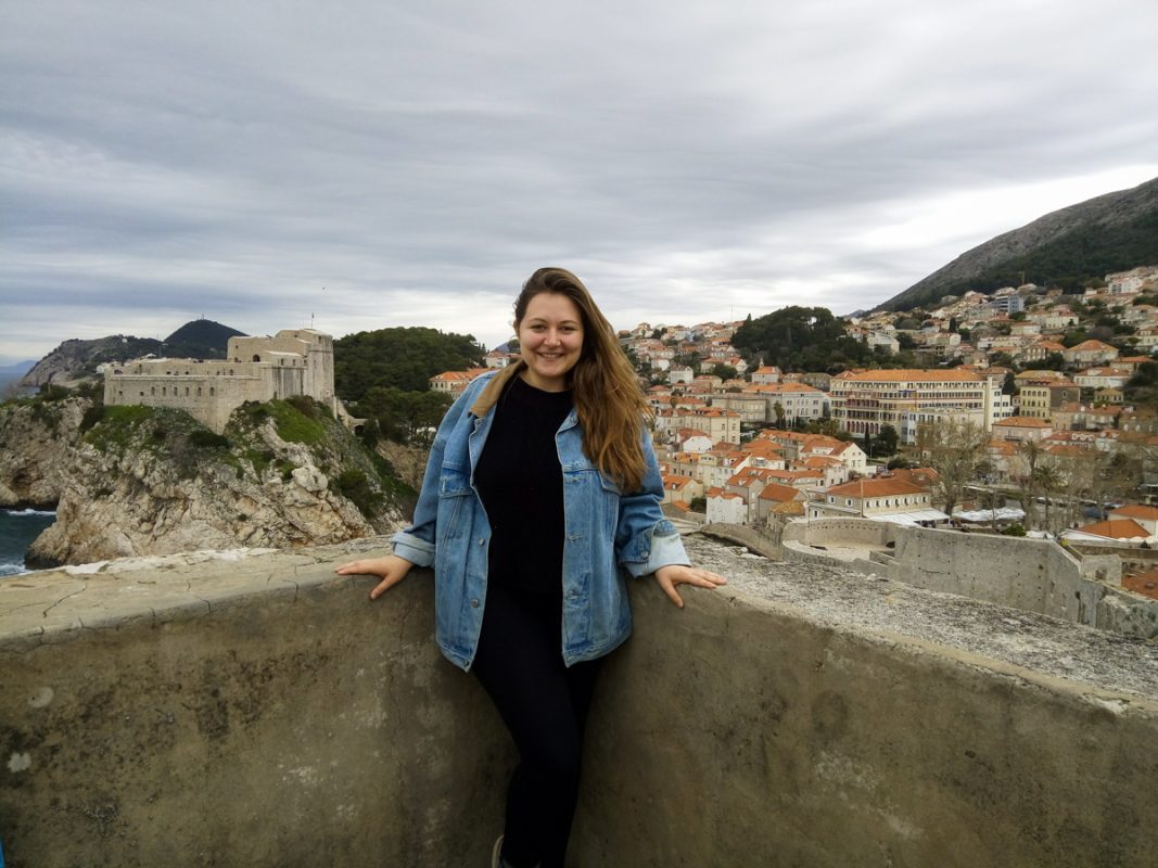 Claire standing infront of Dubrovnik city with rooftops 