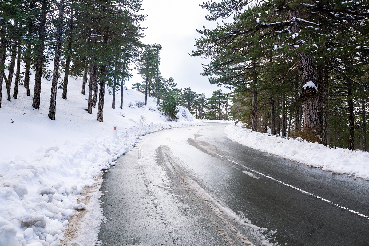 Winter scene with road on Troodos mountains in Cyprus.