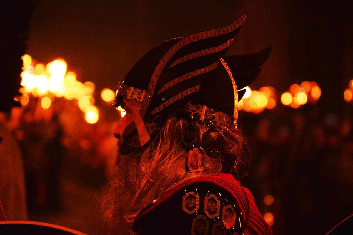 Up helly aa traditional viking fire festival on Shetland men marching with torches