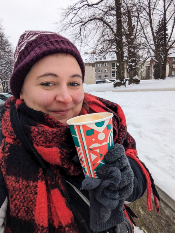 Claire with a hot coffee in Estonia