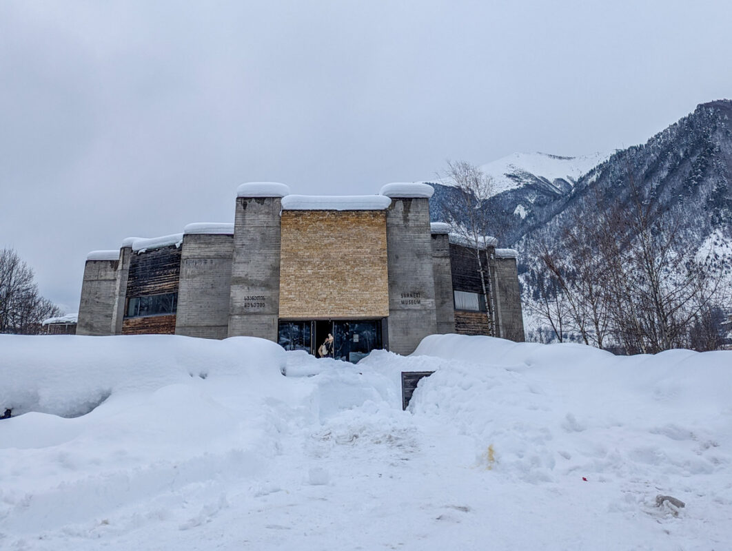 The Svaneti Museum of History and Ethnography, standing against a snowy backdrop.